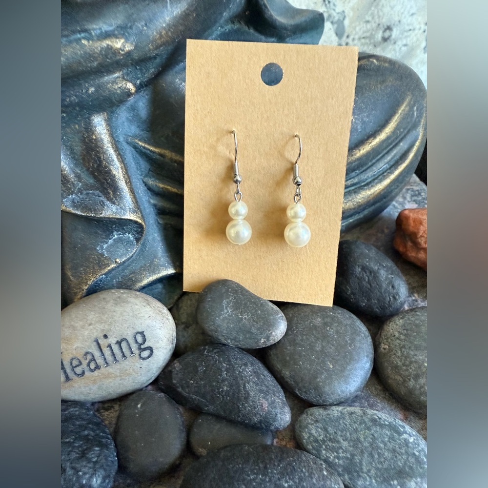 Stainless steel hook drop pearl bead earrings. Rubber backs. New in packaging.